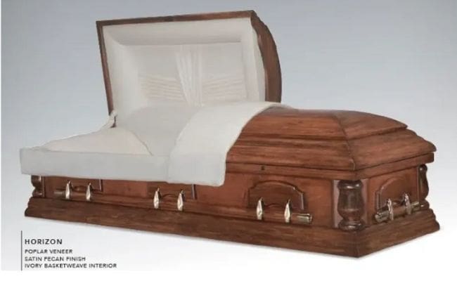 A classic wooden casket with white interior lining.