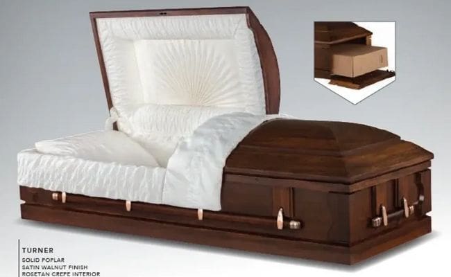 Half-open walnut casket with white lining