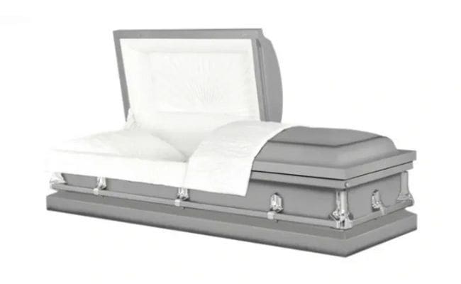 A closed silver casket with white interior lining.