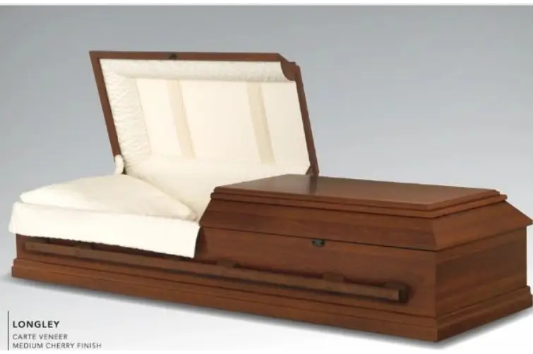 A closed wooden casket with a cushioned interior.
