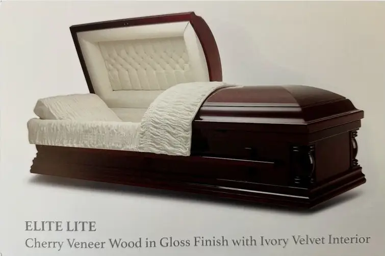 Elegant wooden casket with ivory velvet interior and gloss finish.
