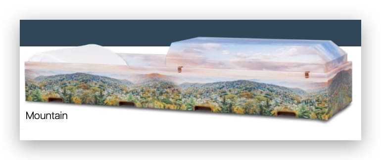 Coffin with scenic mountain landscape design.